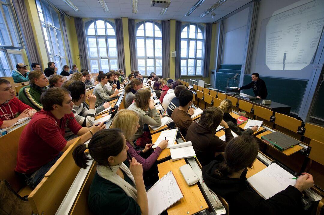 Students sitting in a hall amid a lecture